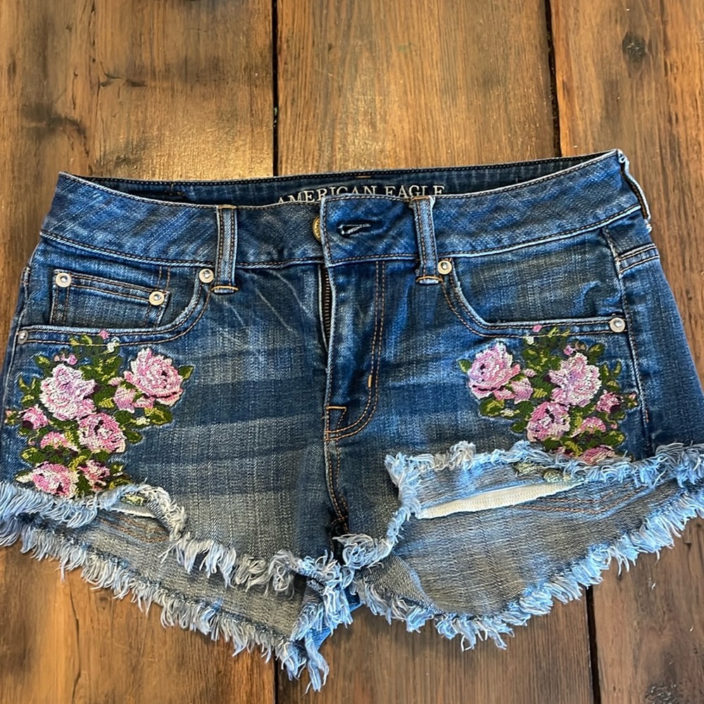 American Eagle jean shorts with flower detailing